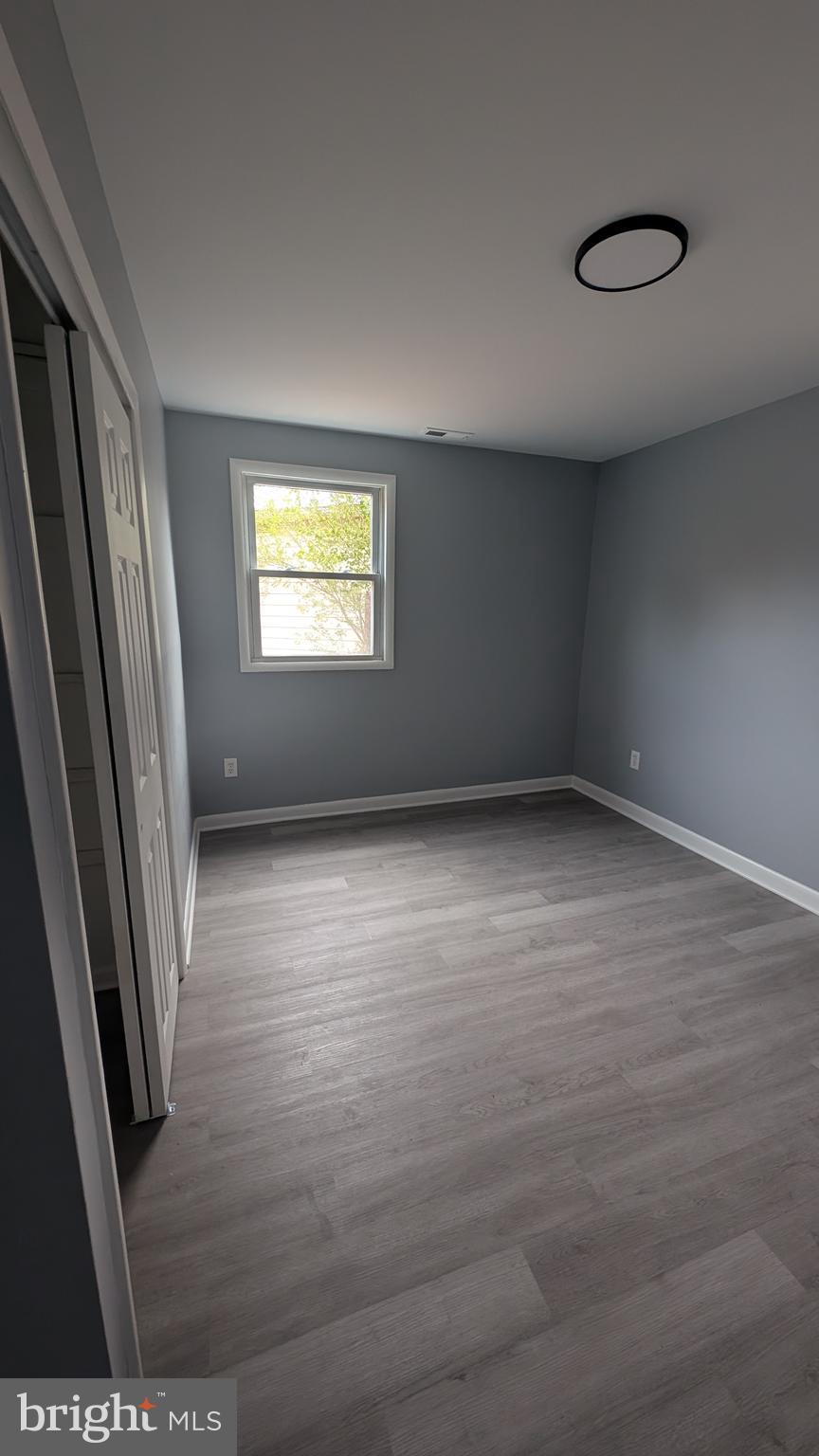 728 Aston Martin Drive Lindenwold, NJ 08021 - Photo 12 of 12 an empty room with wooden floor and windows