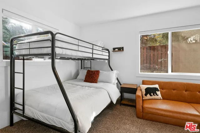 a bed room with a bed and a window