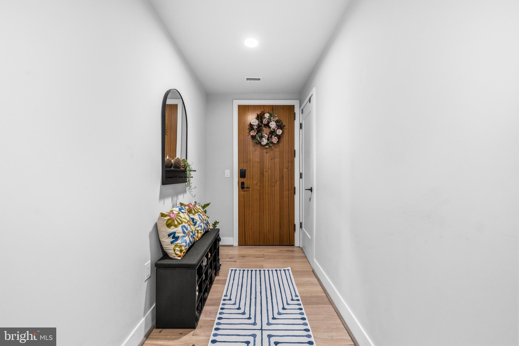 1300 4th Street Southeast, Unit 303 Washington, DC 20003 - Photo 12 of 42 a view of a hallway with wooden floor
