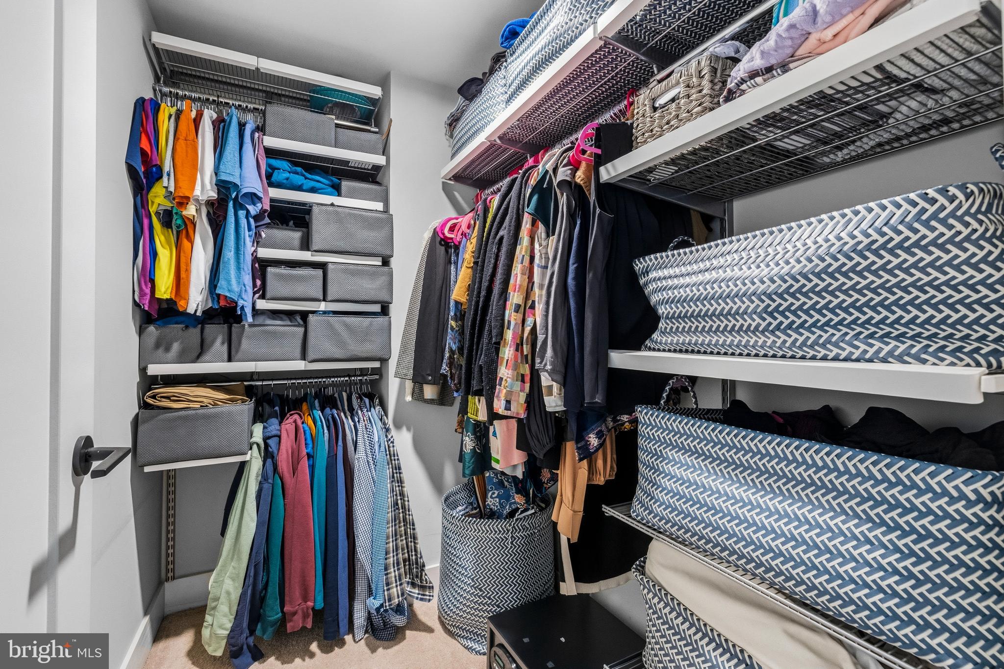 1300 4th Street Southeast, Unit 303 Washington, DC 20003 - Photo 19 of 42 a view of walk in closet with clothes and shoes