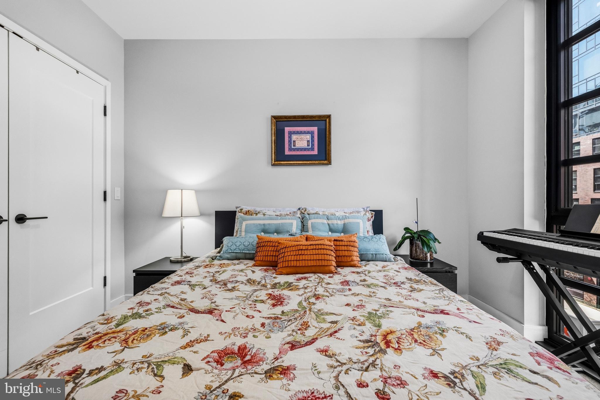 1300 4th Street Southeast, Unit 303 Washington, DC 20003 - Photo 22 of 42 a bedroom with a bed and a window