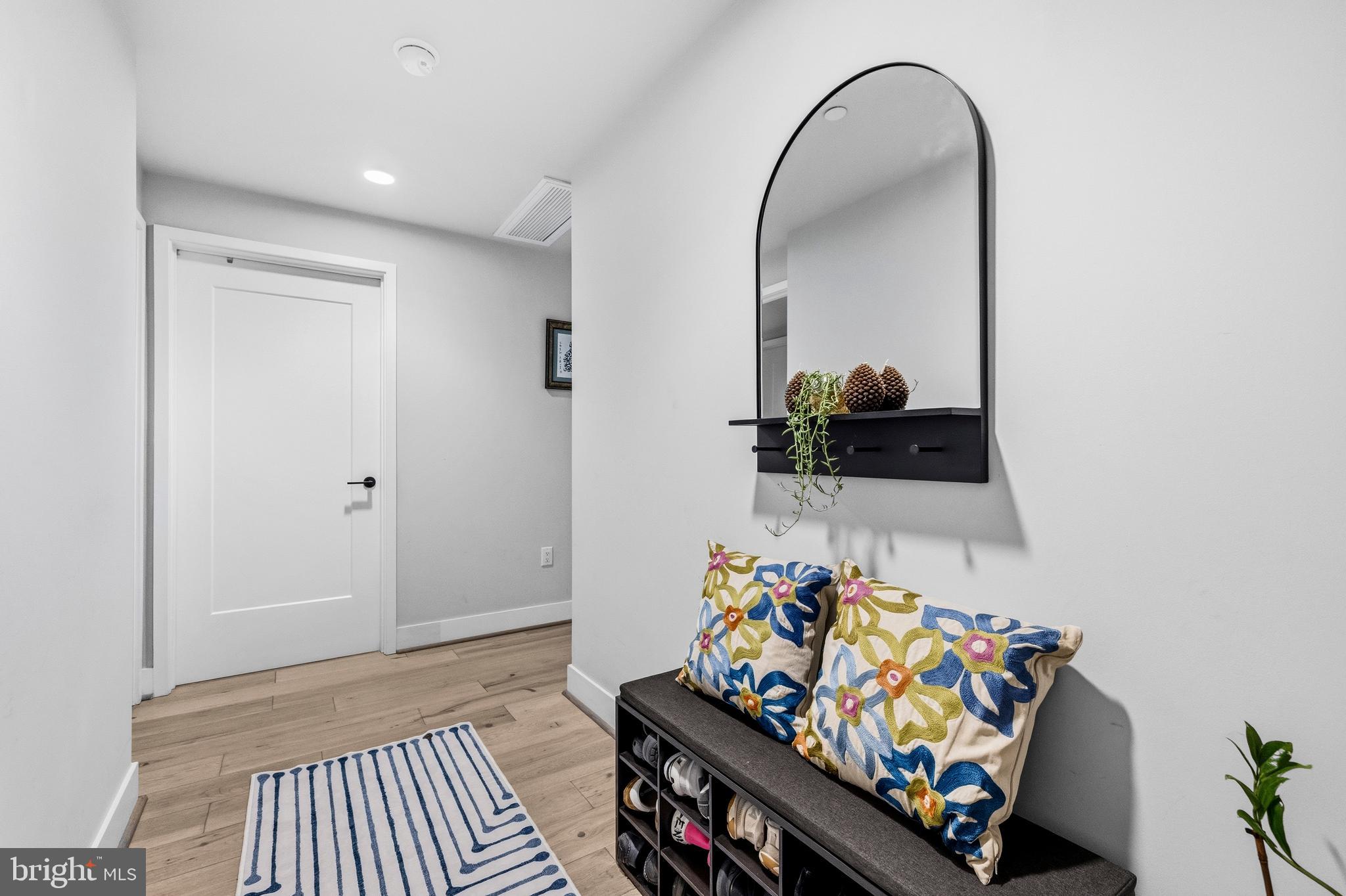 1300 4th Street Southeast, Unit 303 Washington, DC 20003 - Photo 26 of 42 a view of an entryway with wooden floor