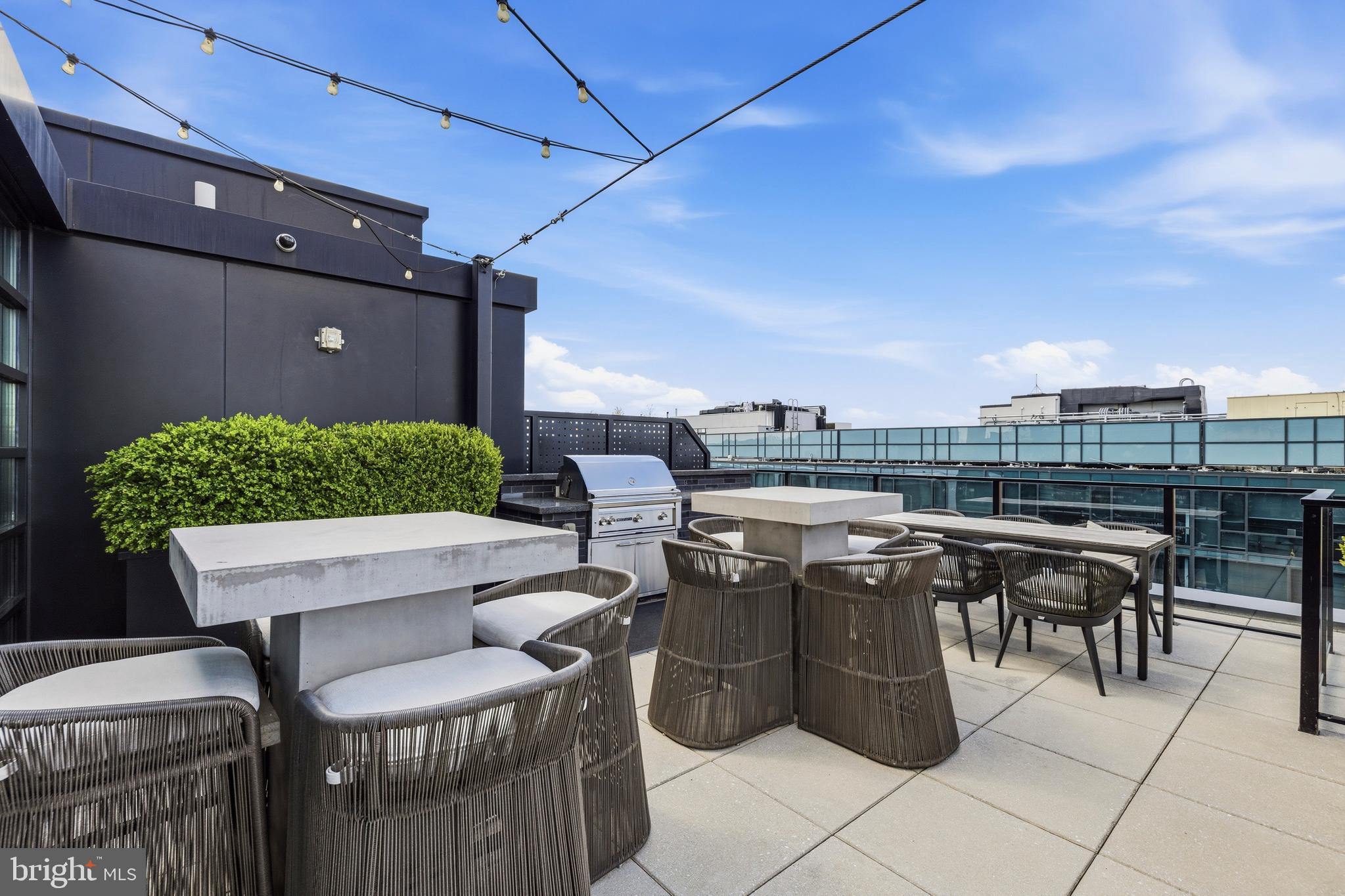 1300 4th Street Southeast, Unit 303 Washington, DC 20003 - Photo 28 of 42 a view of outdoor dining space with furniture and city view