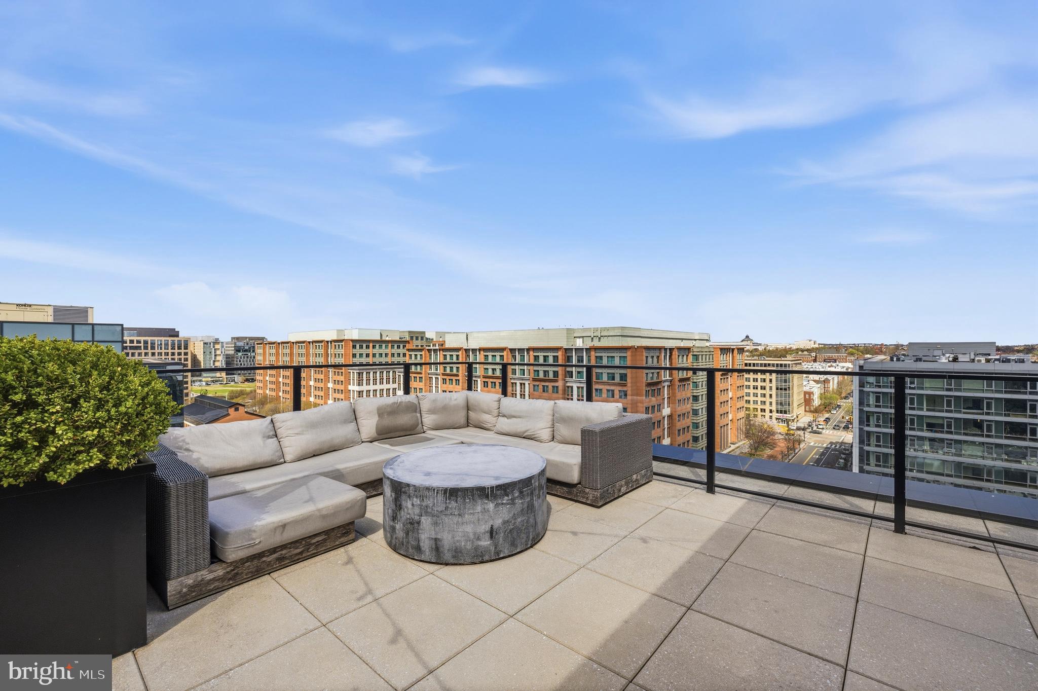1300 4th Street Southeast, Unit 303 Washington, DC 20003 - Photo 30 of 42 a view of roof deck with couches and potted plants