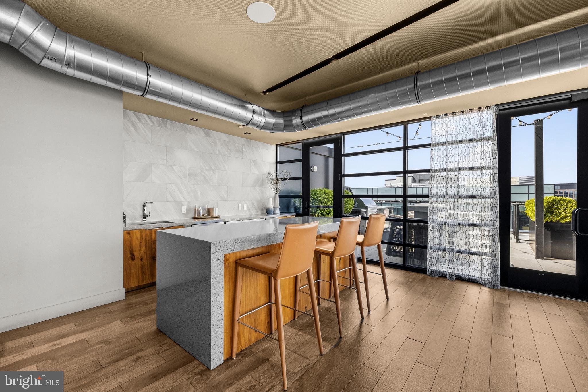 1300 4th Street Southeast, Unit 303 Washington, DC 20003 - Photo 36 of 42 a dining hall with stainless steel appliances granite countertop a stove and a refrigerator