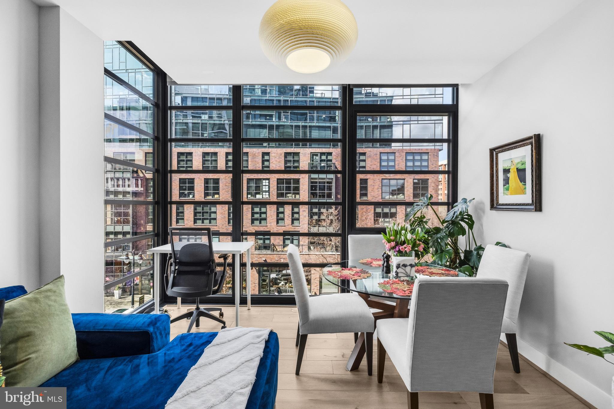 1300 4th Street Southeast, Unit 303 Washington, DC 20003 - Photo 4 of 42 a view of a livingroom with workspace and a bookshelf