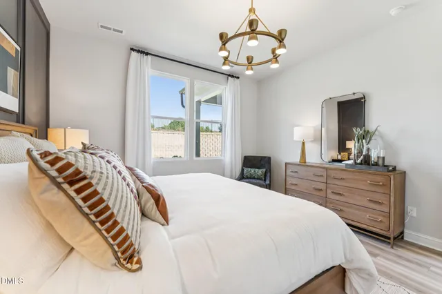 a bathroom with a double vanity sink mirror double and shower