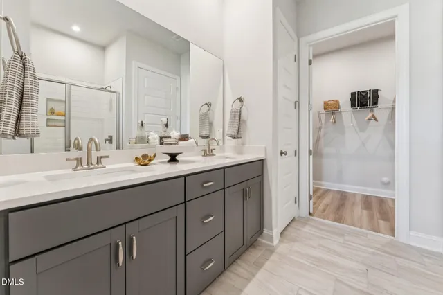 a bathroom with a glass shower door