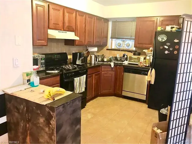 a bedroom with a bed and dresser