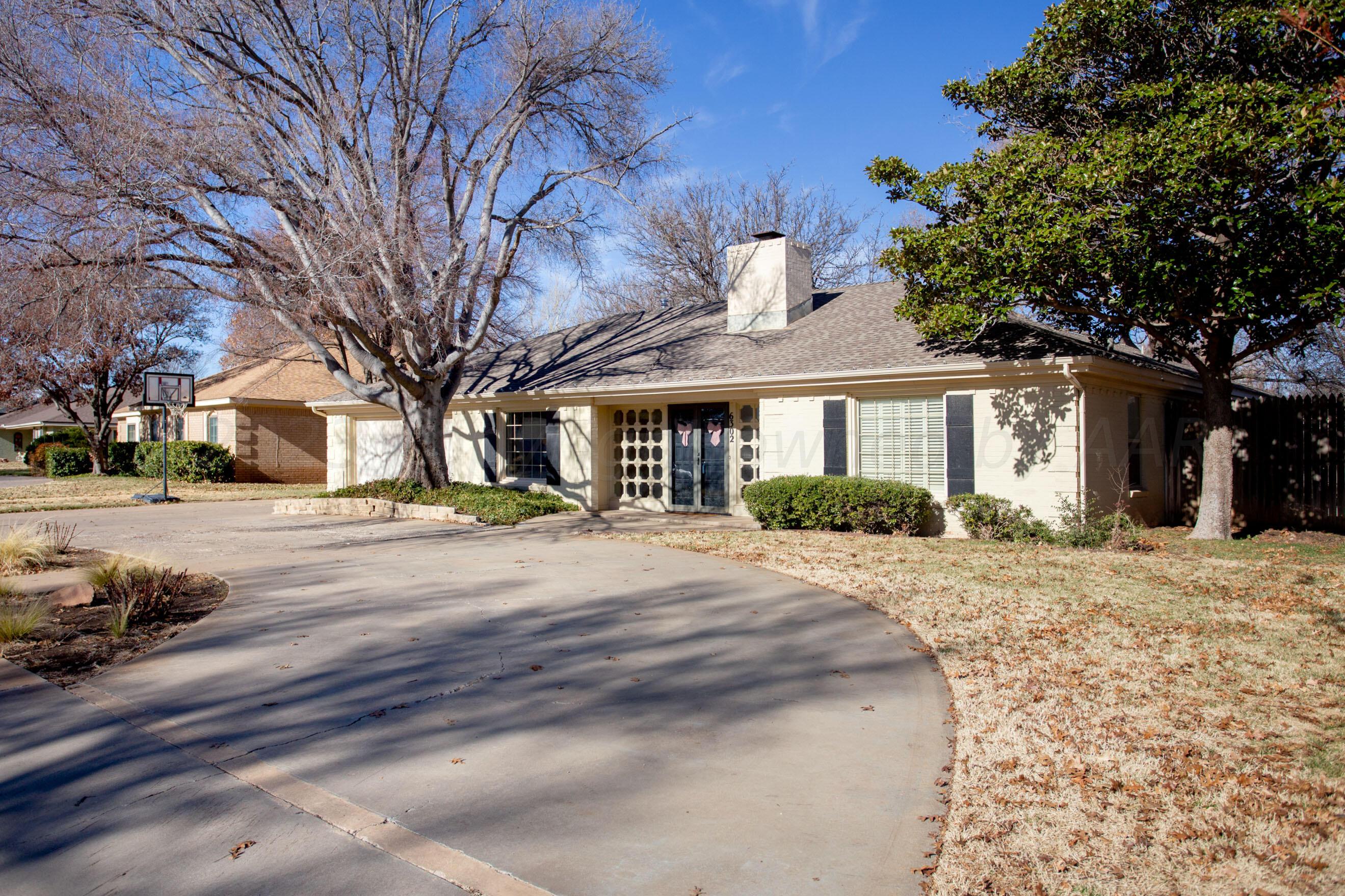 6302 Calumet Road Amarillo, TX 79106 - Photo 1 of 33 a view of a house with a yard