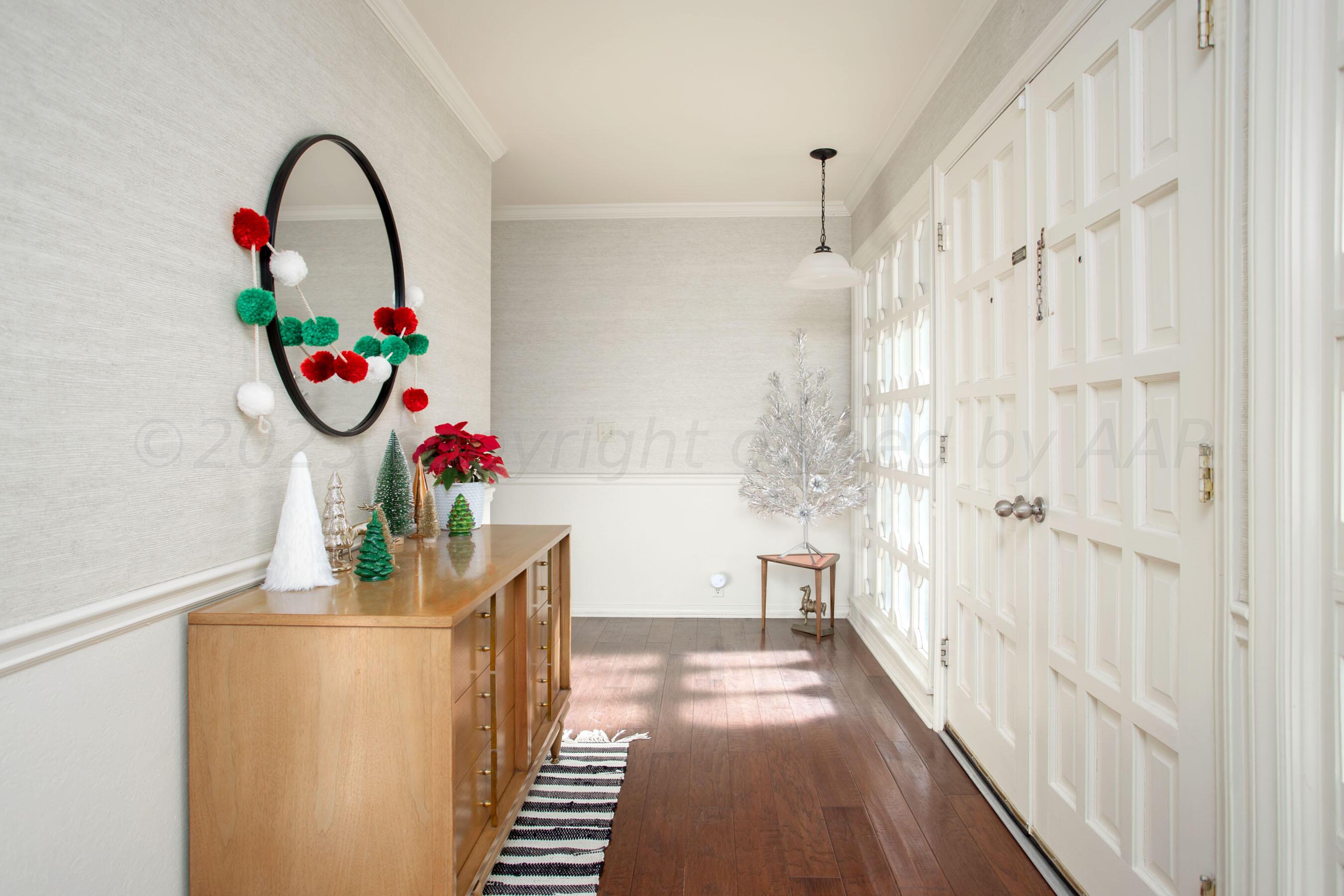6302 Calumet Road Amarillo, TX 79106 - Photo 5 of 33 a view of entryway with wooden floor and potted plant