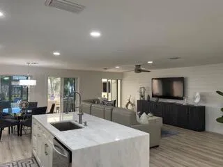 a kitchen with counter top space a sink and cabinets