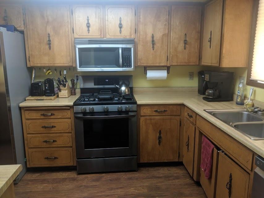 Gas stove with built in microwave