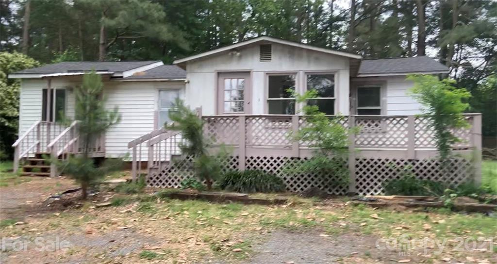 1975 Gold Hill Road Fort Mill, SC 29708 - Photo 2 of 4 a front view of a house with a garden