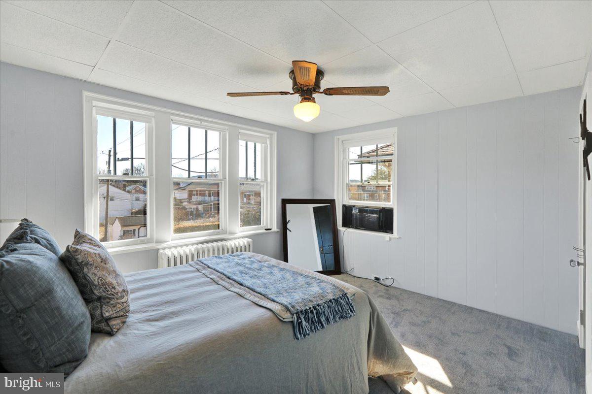 2133 Fairview Street Reading, PA 19609 - Photo 13 of 34 a bedroom with a large bed and a window