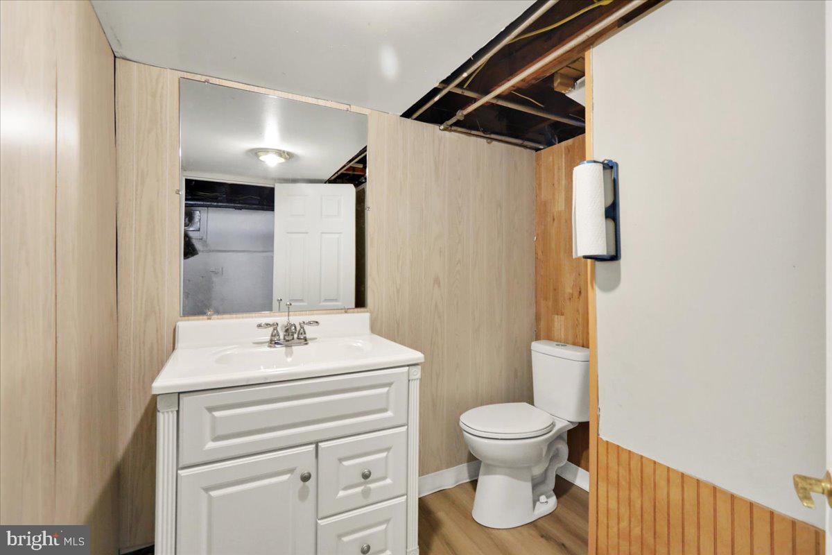 2133 Fairview Street Reading, PA 19609 - Photo 27 of 34 a bathroom with a toilet sink and mirror