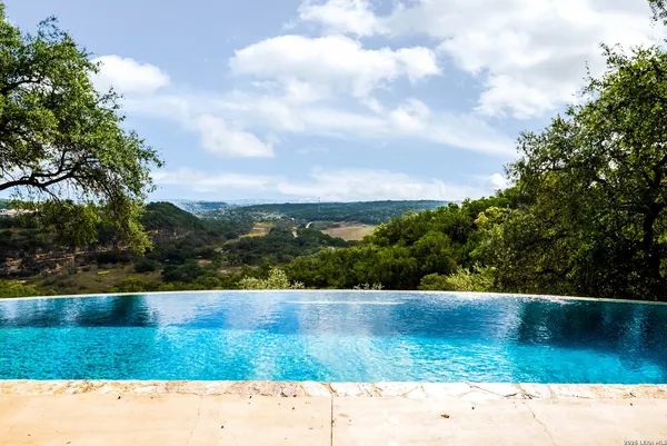 a view of park with bench and trees