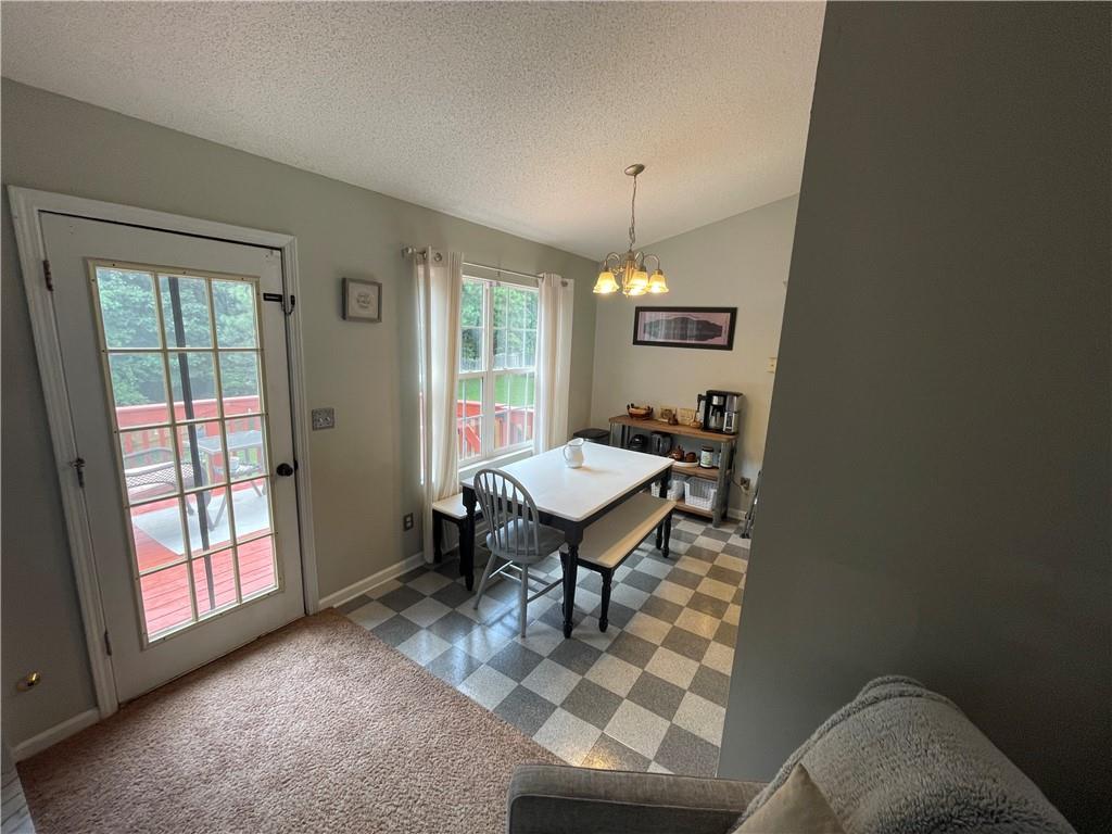 1720 Fort Daniels Trail Dacula, GA 30019 - Photo 18 of 32 a view of a livingroom with furniture and a window