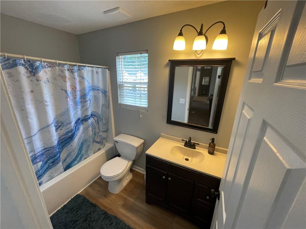 1720 Fort Daniels Trail Dacula, GA 30019 - Photo 21 of 32 a bathroom with a sink vanity mirror and toilet