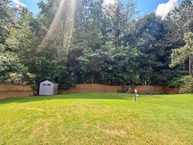 1720 Fort Daniels Trail Dacula, GA 30019 - Photo 3 of 32 a view of a swimming pool with a yard