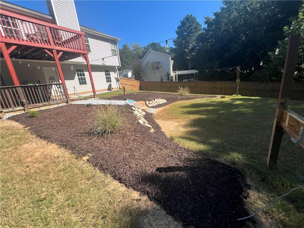 1720 Fort Daniels Trail Dacula, GA 30019 - Photo 32 of 32 a view of a house with a yard