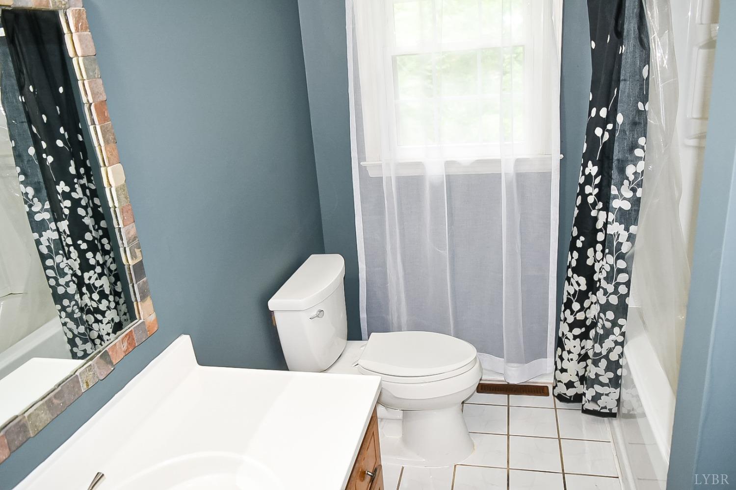 243 West Spencer Road Hurt, VA 24563 - Photo 9 of 28 a white toilet sitting next to a window