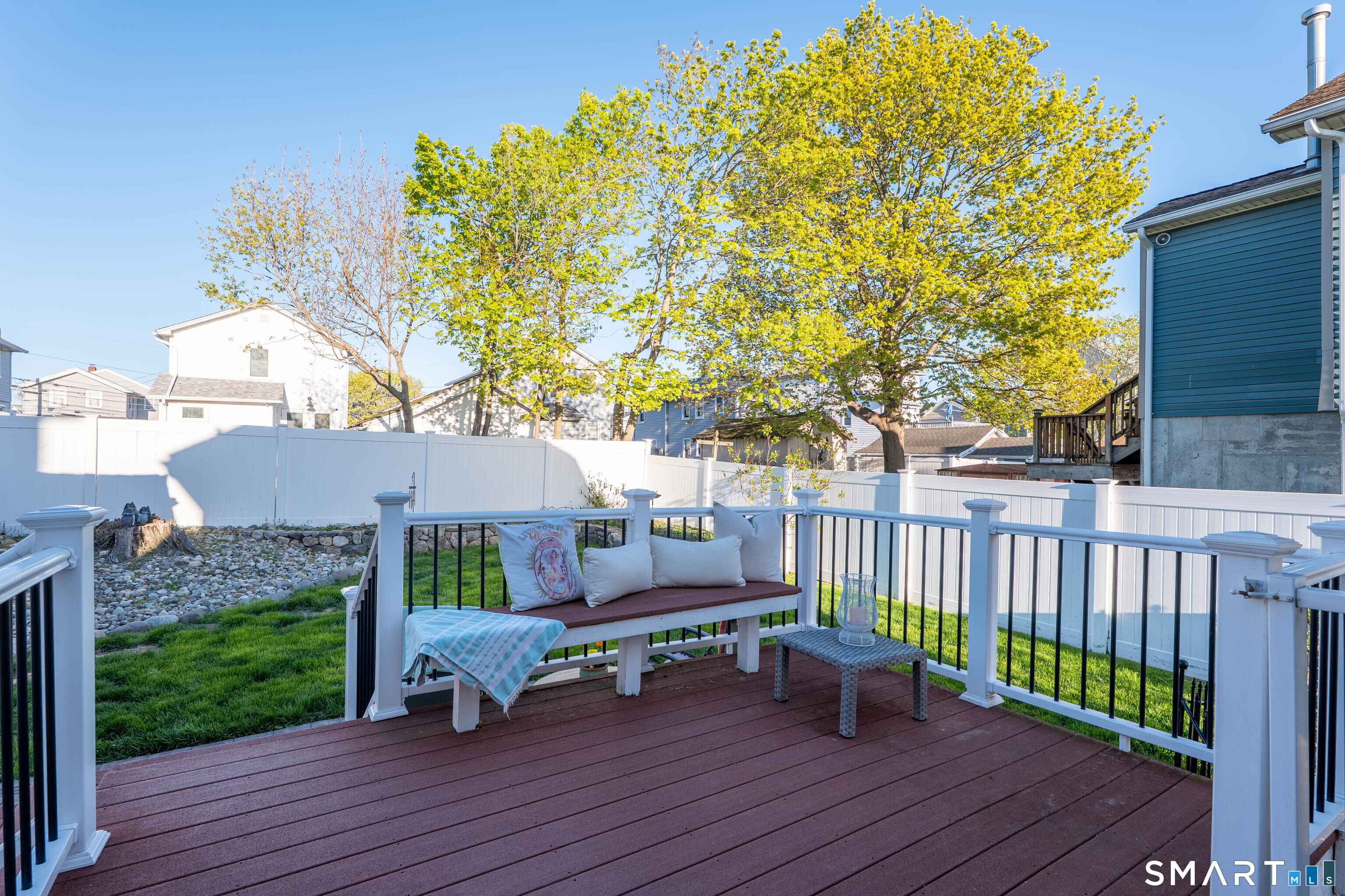 19 Elaine Road Milford, CT 06460 - Photo 11 of 24 a view of a deck with table and chairs and wooden floor