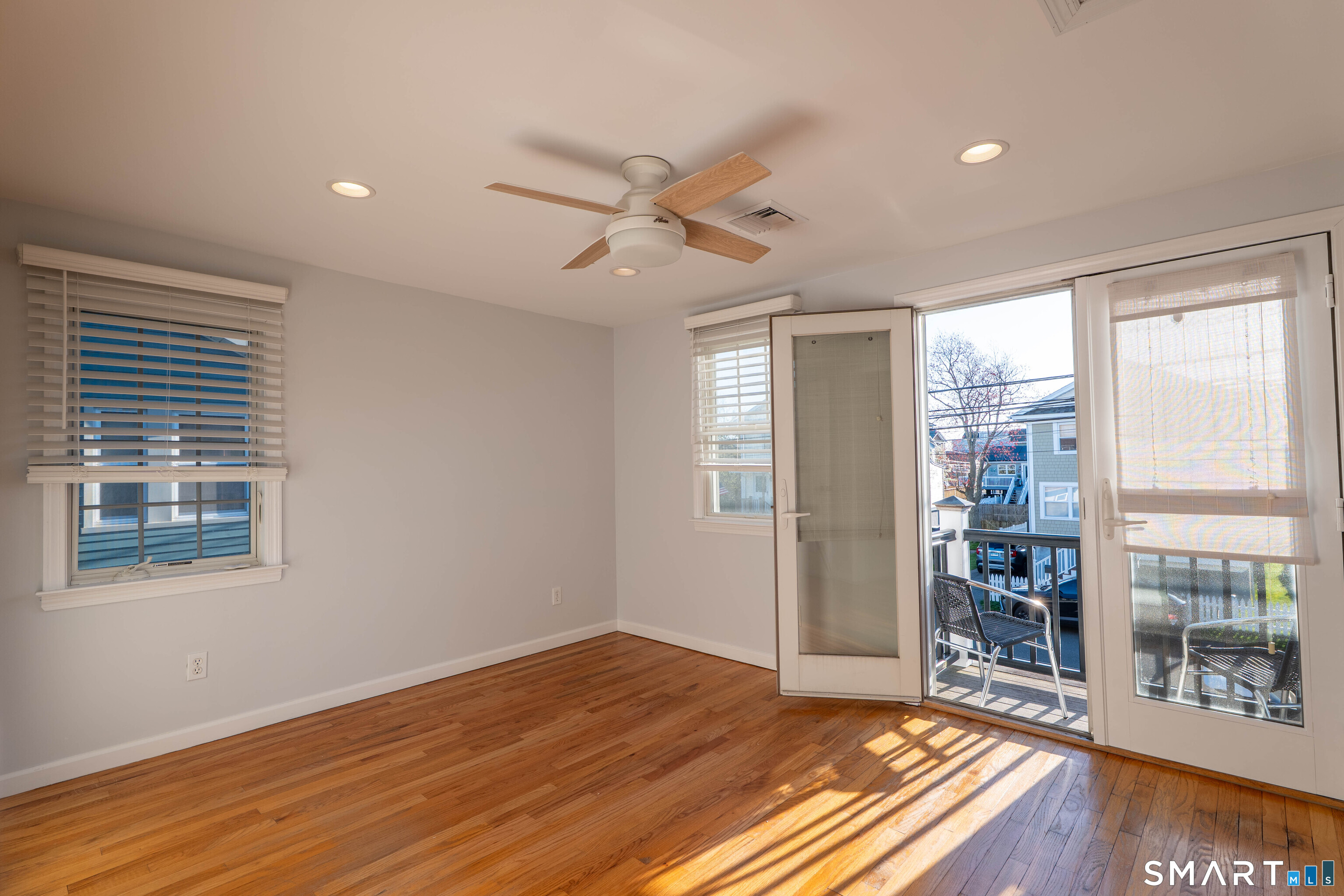 19 Elaine Road Milford, CT 06460 - Photo 17 of 24 a view of an empty room with window and wooden floor