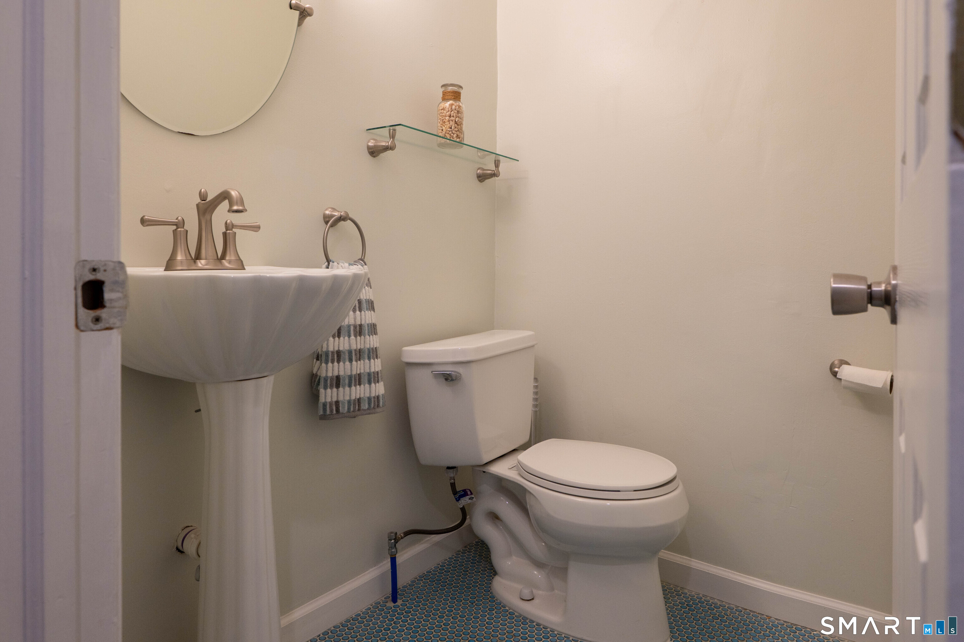 19 Elaine Road Milford, CT 06460 - Photo 21 of 24 a bathroom with a toilet sink and mirror