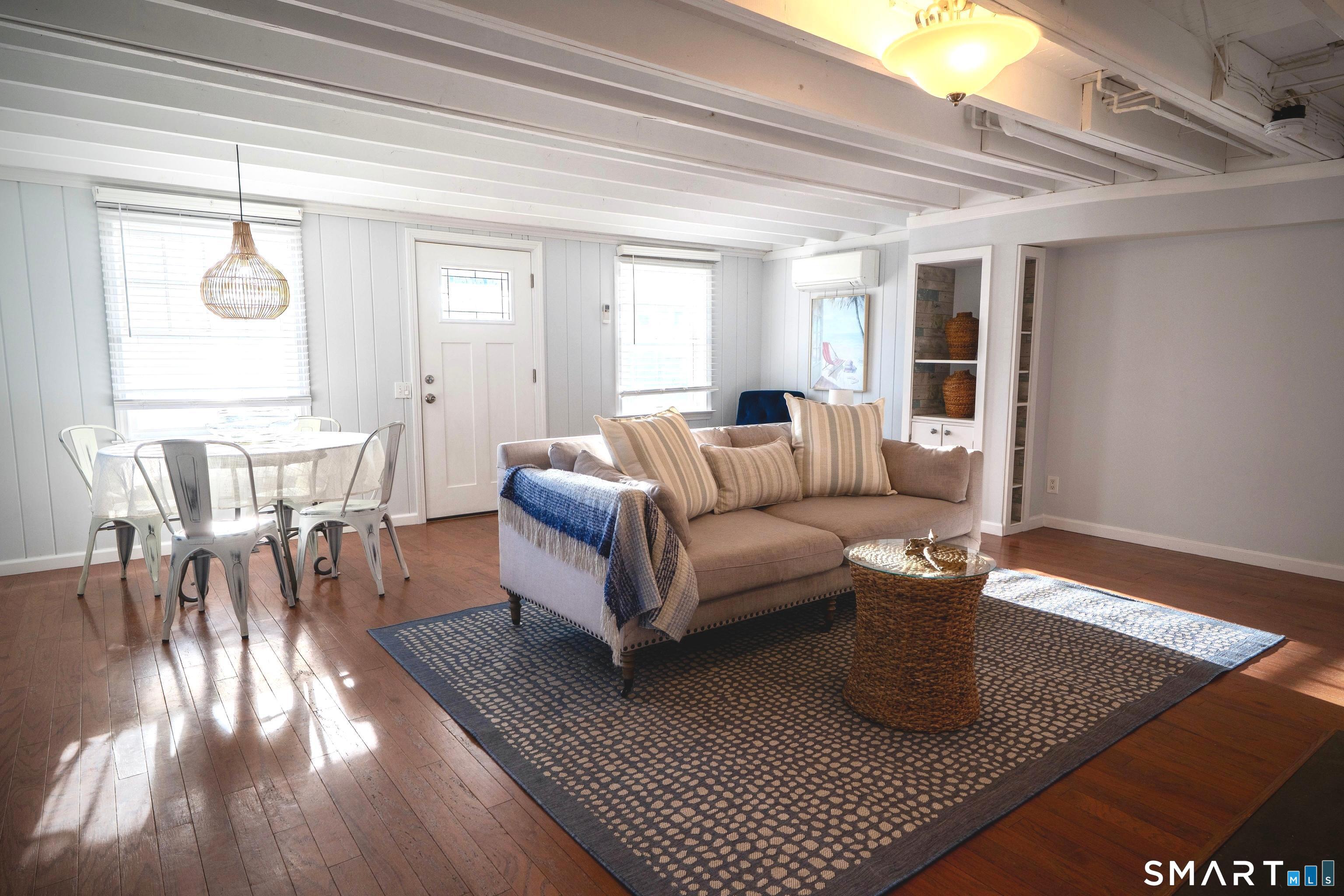 19 Elaine Road Milford, CT 06460 - Photo 6 of 24 a living room with furniture and a table