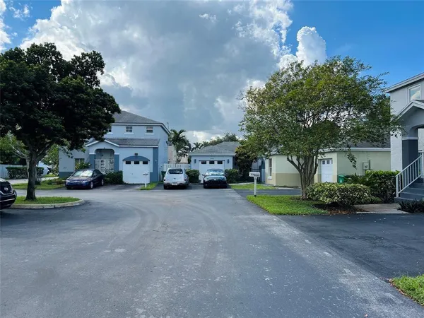 a view of a car parked in front of a house