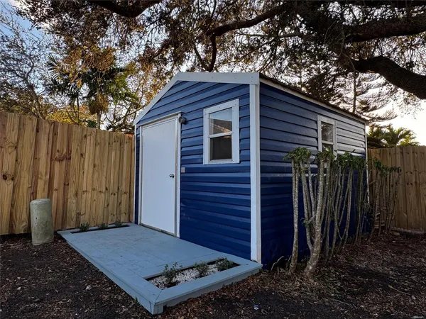 a view of a house with a tree