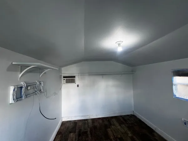 a view of a porch with wooden floor