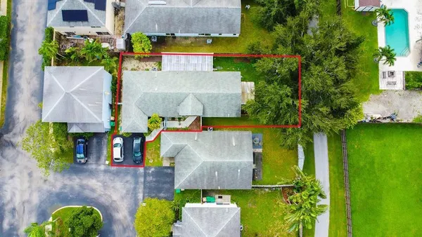 an aerial view of a house with a garden