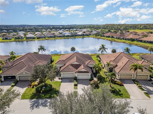 an aerial view of a house with a lake view