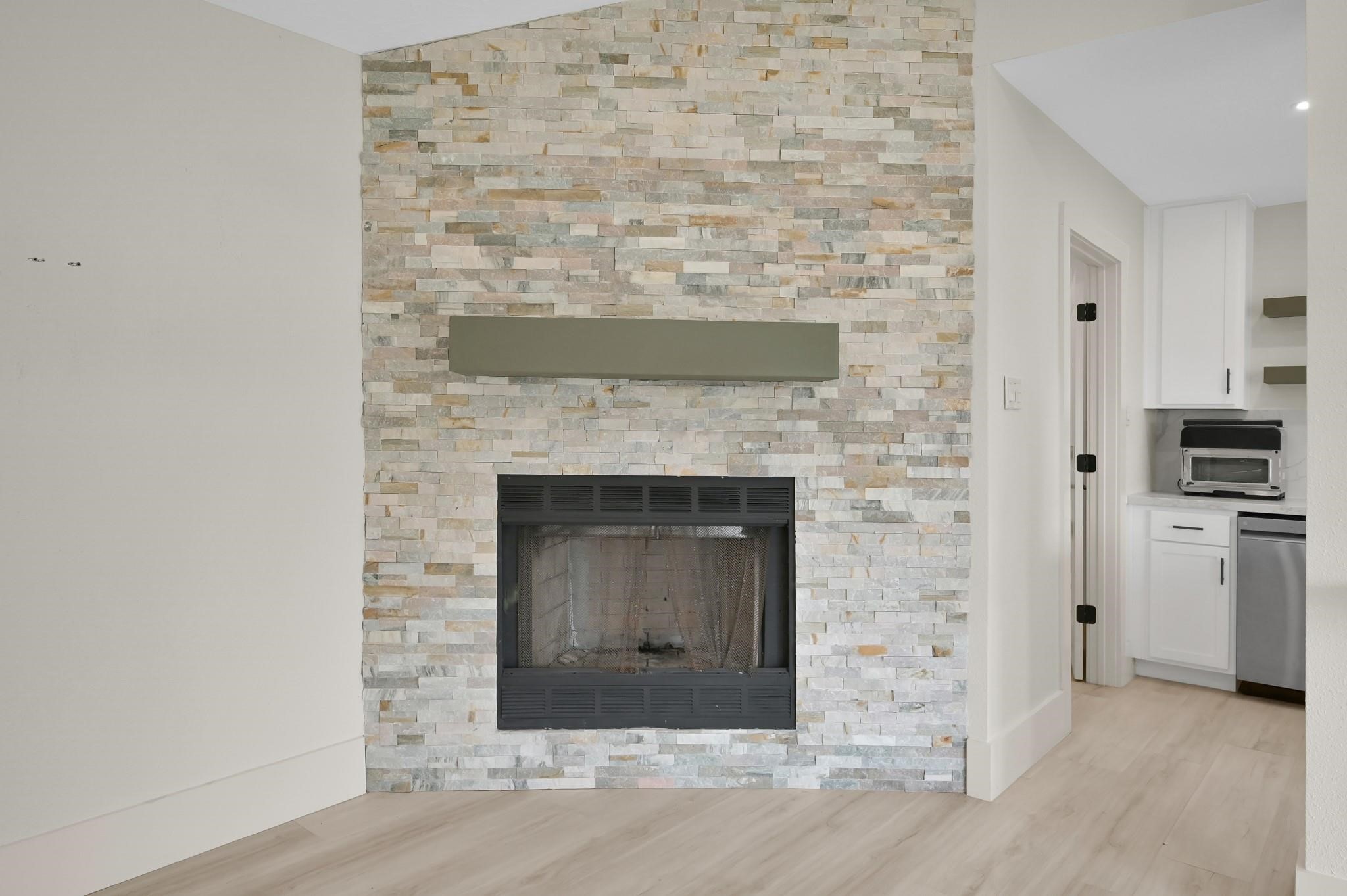 6026 Willowbend Boulevard Houston, TX 77096 - Photo 11 of 46 a view of an empty room and fire place