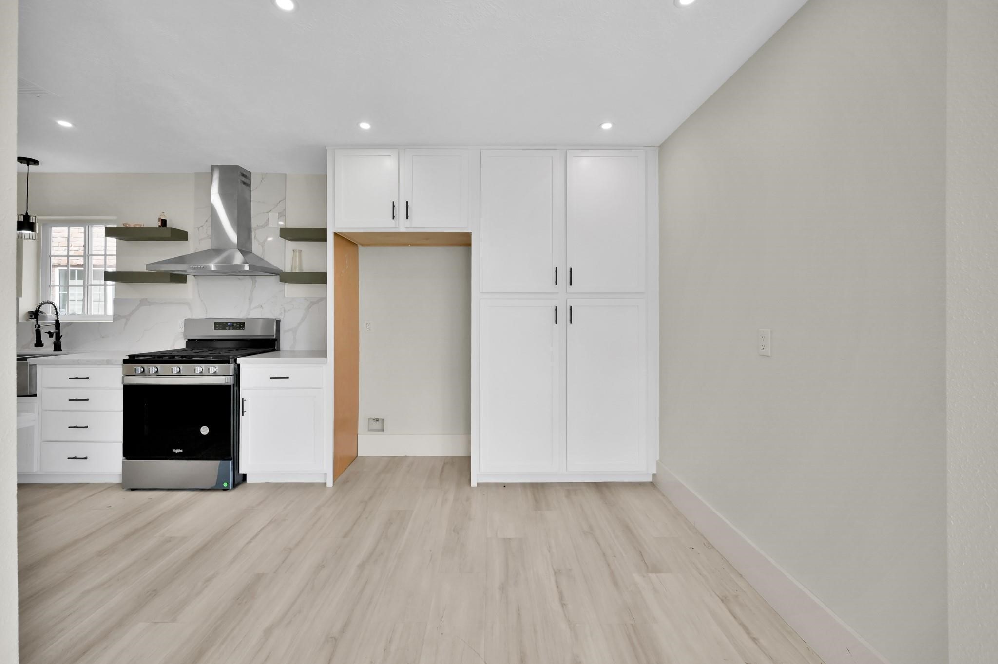 6026 Willowbend Boulevard Houston, TX 77096 - Photo 20 of 46 a kitchen with stainless steel appliances granite countertop a refrigerator and a stove top oven