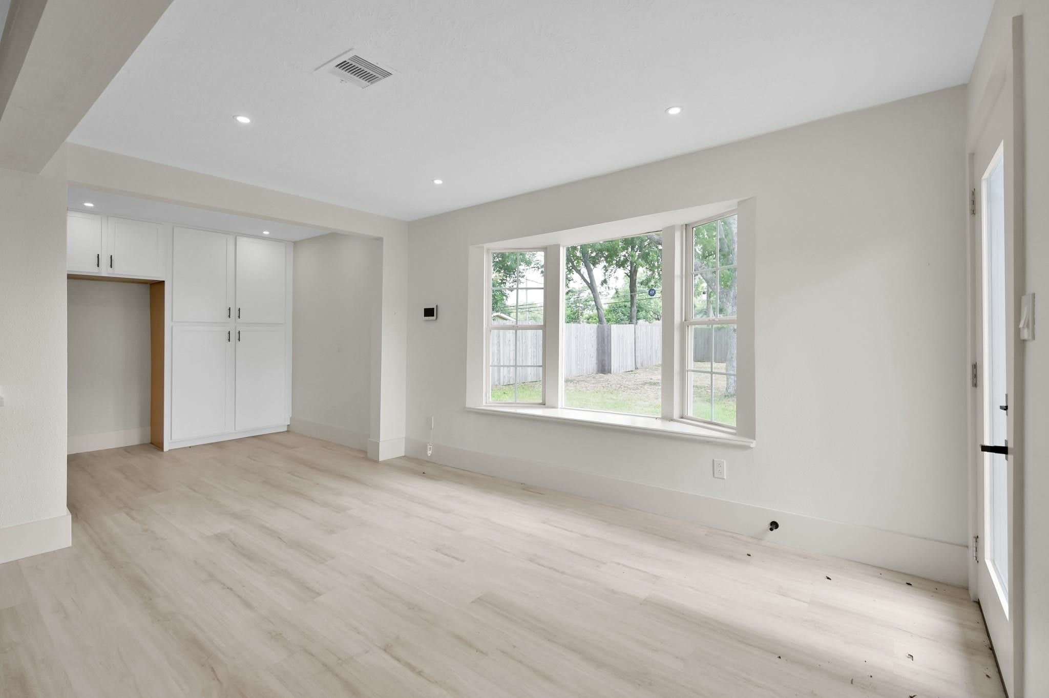 6026 Willowbend Boulevard Houston, TX 77096 - Photo 23 of 46 a view of an empty room with a window