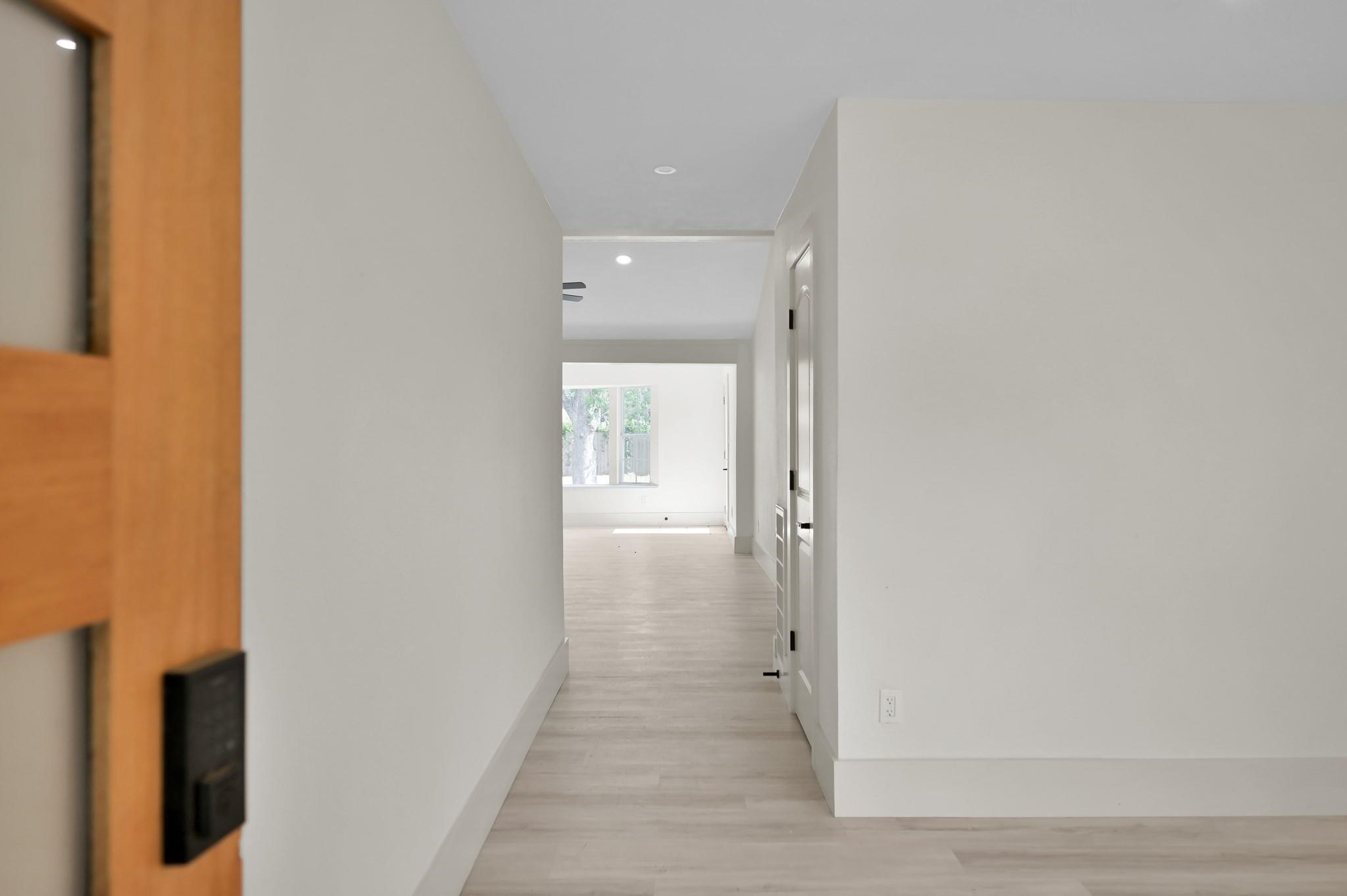 6026 Willowbend Boulevard Houston, TX 77096 - Photo 3 of 46 a view of a bathroom from a hallway