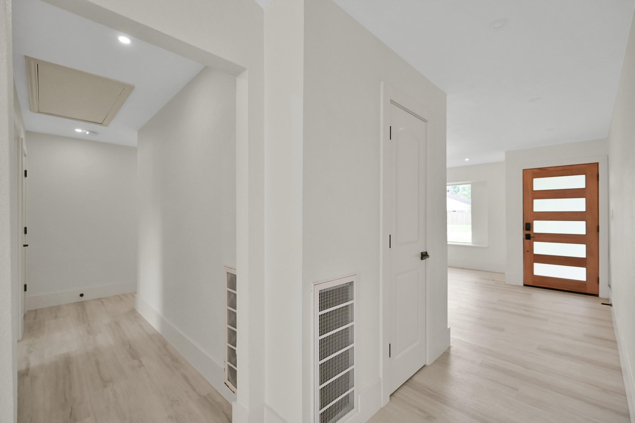 6026 Willowbend Boulevard Houston, TX 77096 - Photo 41 of 46 wooden floor in an empty room and a bathroom