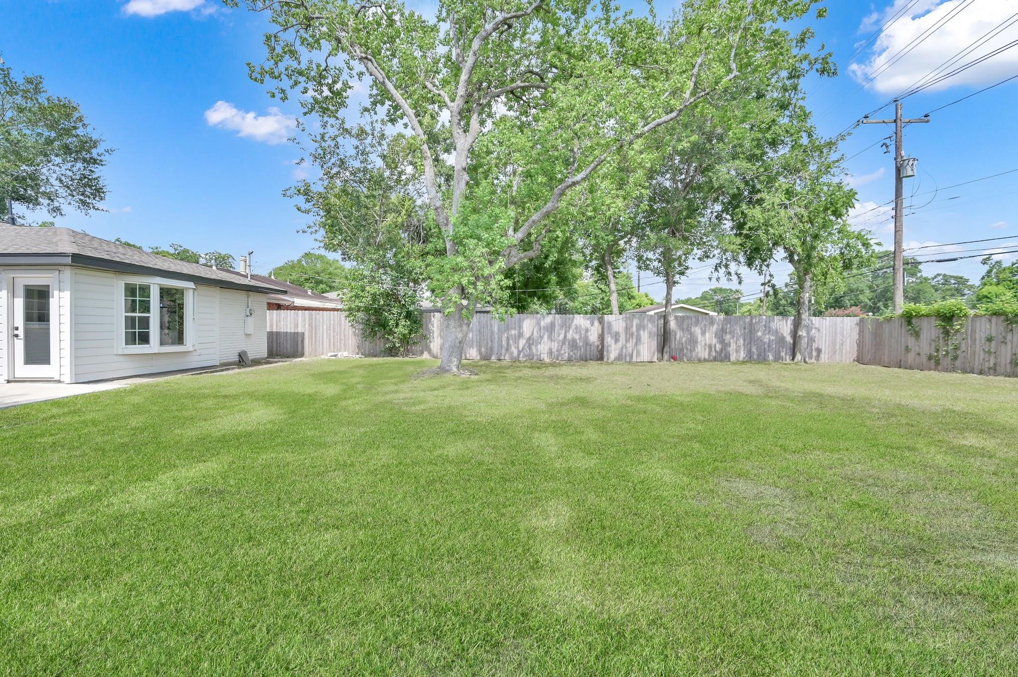6026 Willowbend Boulevard Houston, TX 77096 - Photo 43 of 46 a house view with a garden