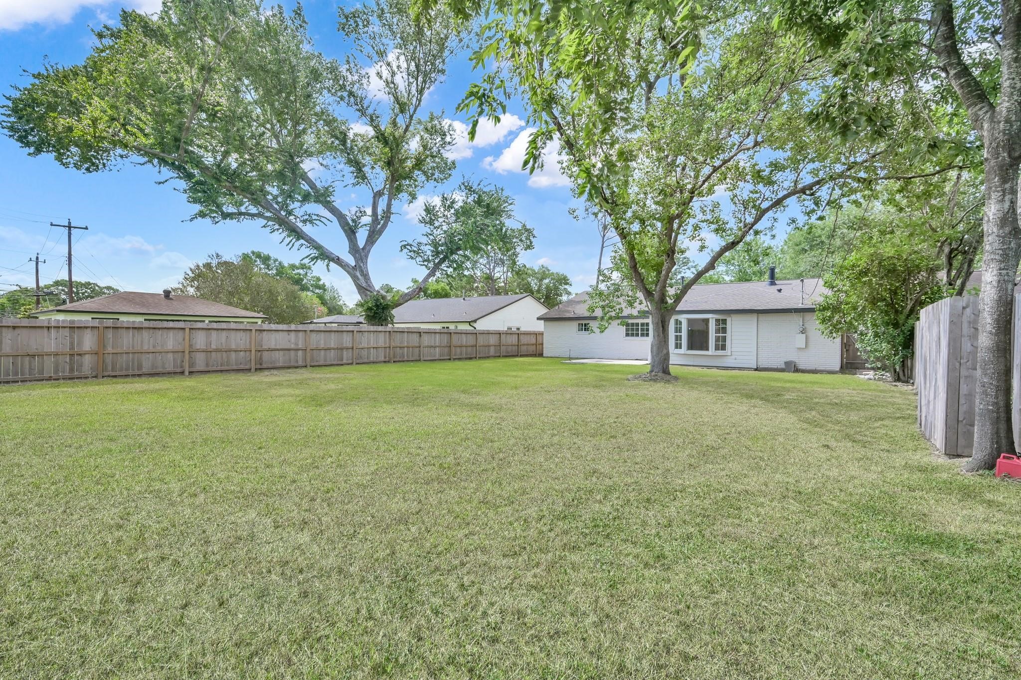 6026 Willowbend Boulevard Houston, TX 77096 - Photo 44 of 46 a view of a house with a yard