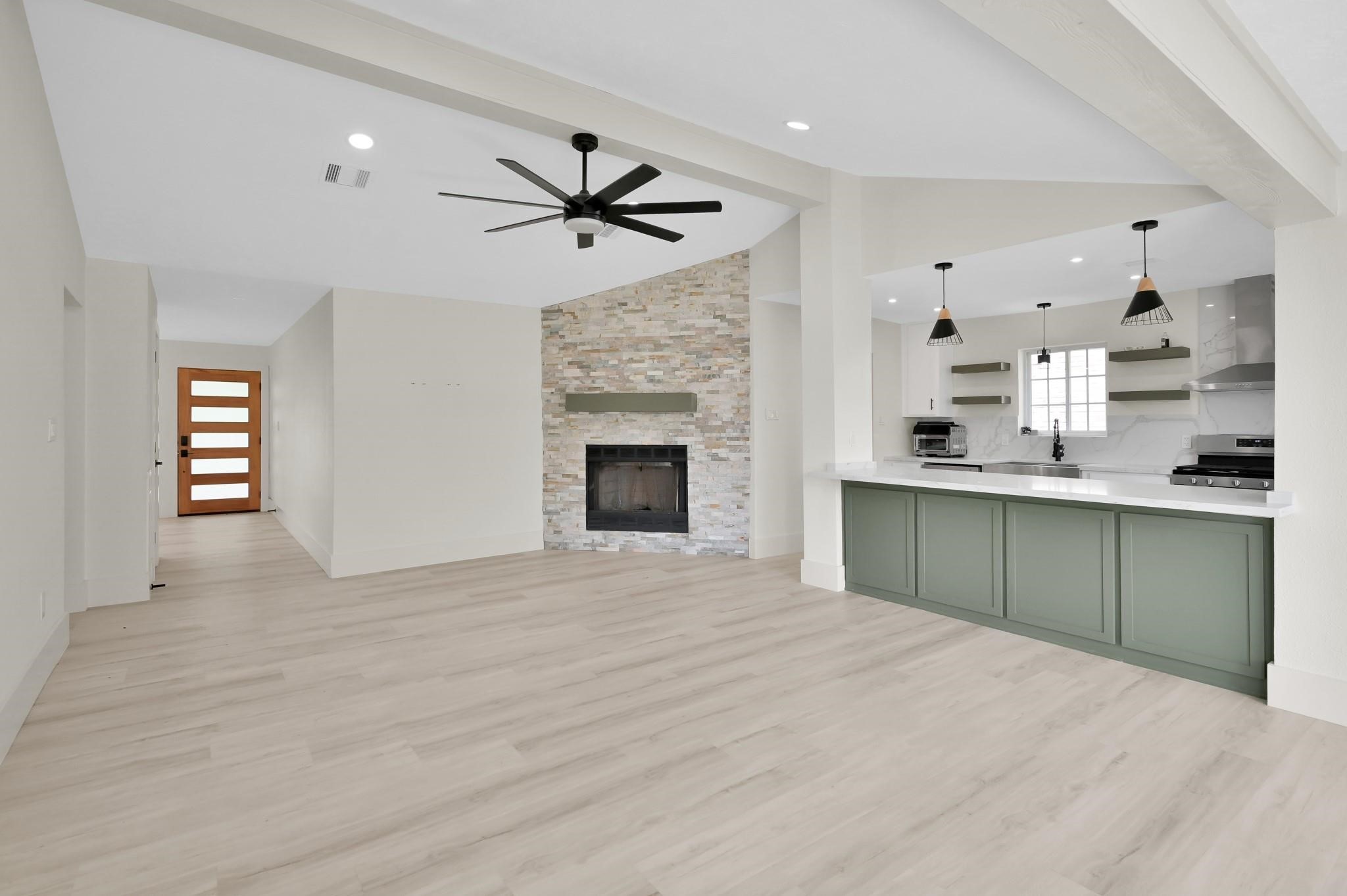 6026 Willowbend Boulevard Houston, TX 77096 - Photo 8 of 46 a bedroom with a bed and a fireplace