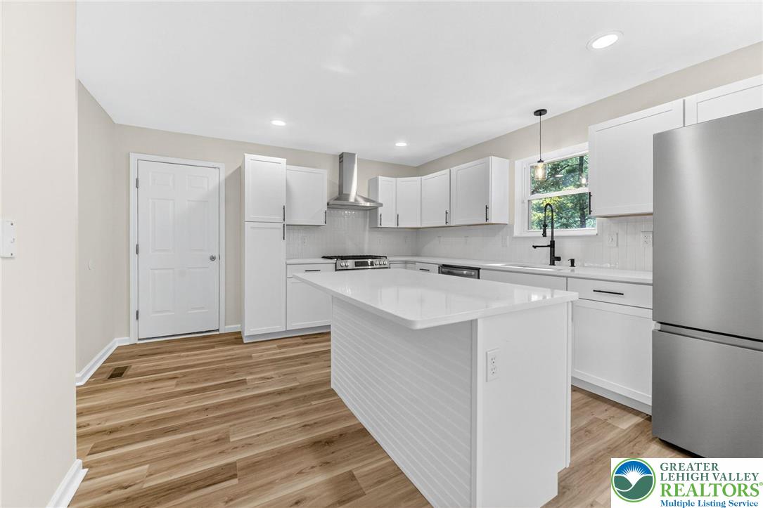 45 Coach Road Stroudsburg, PA 18360 - Photo 12 of 44 a kitchen with stainless steel appliances a refrigerator sink and white cabinets