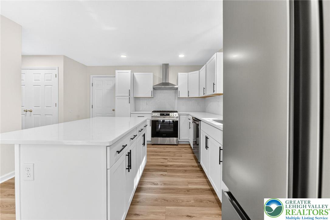 45 Coach Road Stroudsburg, PA 18360 - Photo 13 of 44 a large kitchen with a white stove top oven and white cabinets