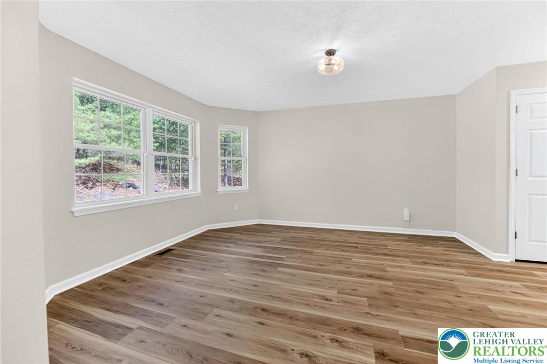 45 Coach Road Stroudsburg, PA 18360 - Photo 17 of 44 a view of an empty room with wooden floor and a window