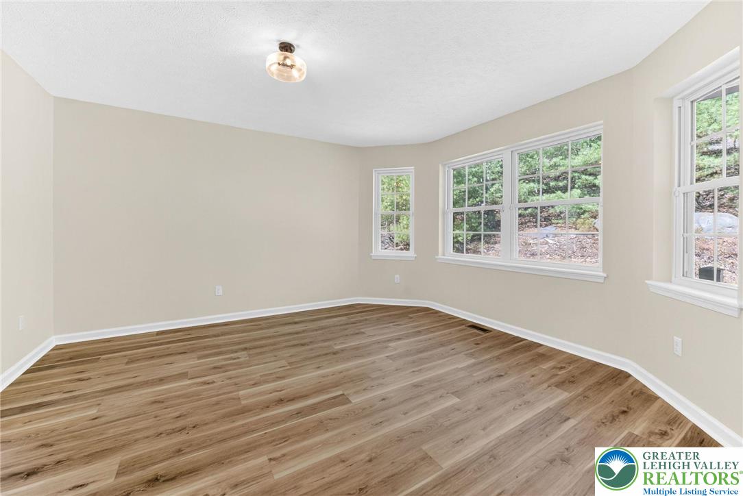 45 Coach Road Stroudsburg, PA 18360 - Photo 18 of 44 a view of an empty room with wooden floor and a window