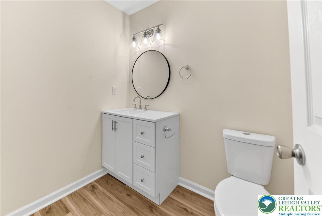45 Coach Road Stroudsburg, PA 18360 - Photo 21 of 44 a bathroom with a toilet a sink and a mirror