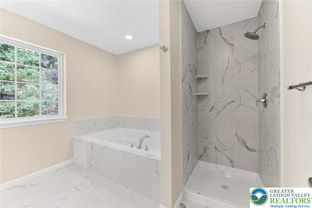 45 Coach Road Stroudsburg, PA 18360 - Photo 25 of 44 a bathroom with a bathtub and a shower