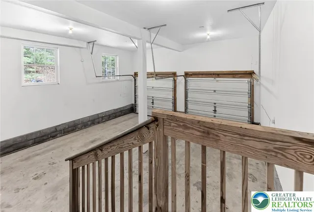 a spacious bathroom with a granite countertop sink and a window